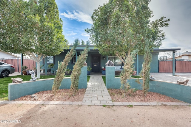 view of front of home with a carport