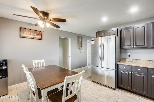 kitchen with stainless steel refrigerator and ceiling fan