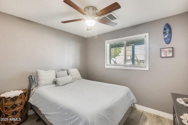 bedroom featuring hardwood / wood-style floors and ceiling fan