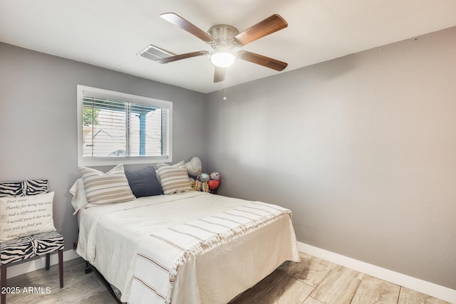 bedroom with hardwood / wood-style flooring and ceiling fan