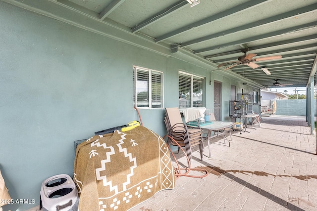 view of patio featuring ceiling fan