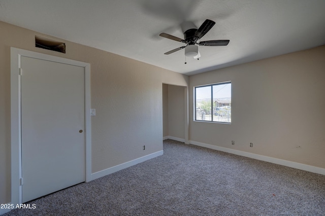 unfurnished bedroom with carpet, baseboards, and ceiling fan
