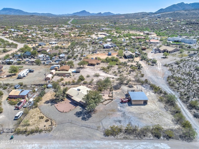 aerial view of residential area featuring mountains