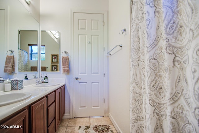 bathroom with tile patterned flooring and vanity