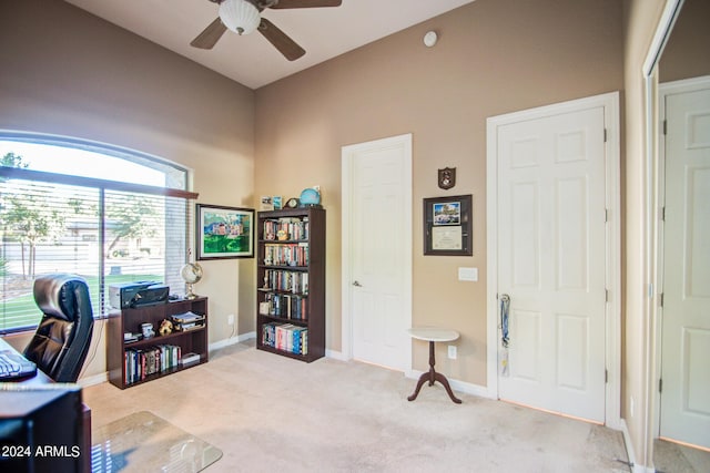 office area featuring light colored carpet and ceiling fan