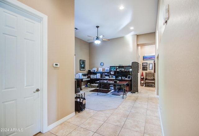 hall featuring light tile patterned floors