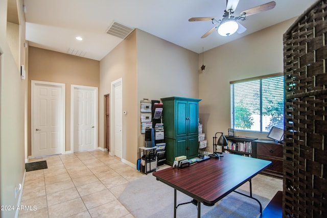 office featuring light tile patterned flooring and ceiling fan