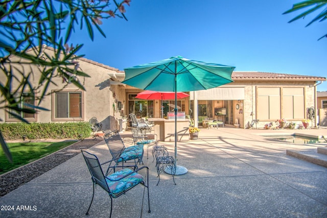 view of patio featuring exterior bar