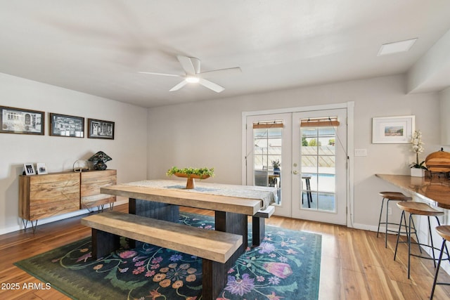 13842 N 40th Ave, Phoenix, AZ 85053 - dining area featuring wood finished floors, french doors, and ceiling fan
