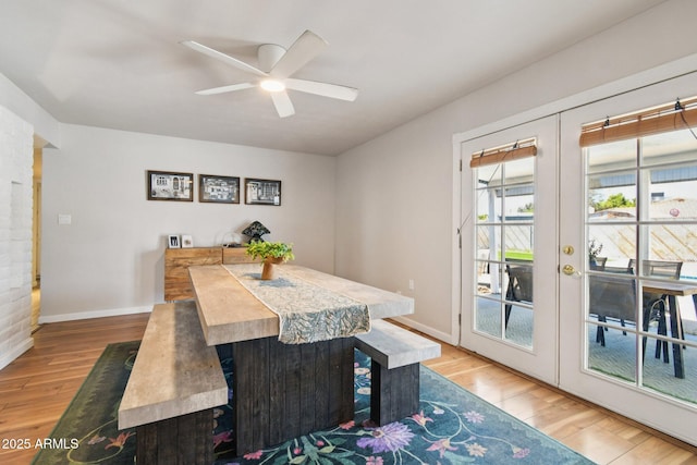13842 N 40th Ave, Phoenix, AZ 85053 - dining space featuring light wood finished floors, ceiling fan, and french doors