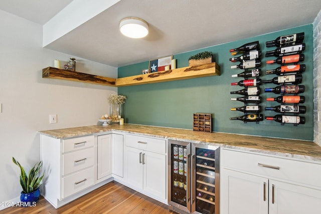 13842 N 40th Ave, Phoenix, AZ 85053 - indoor dry bar with wine cooler and light wood finished floors