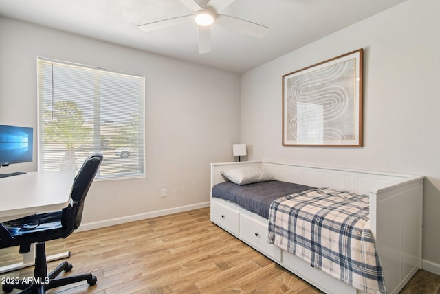 13842 N 40th Ave, Phoenix, AZ 85053 - bedroom with light wood finished floors, an office area, and a ceiling fan
