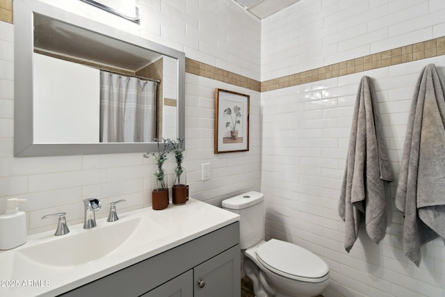13842 N 40th Ave, Phoenix, AZ 85053 - bathroom with tile walls, vanity, and tasteful backsplash