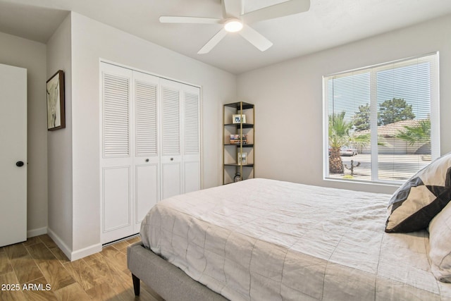 13842 N 40th Ave, Phoenix, AZ 85053 - bedroom featuring a closet, wood finished floors, and a ceiling fan