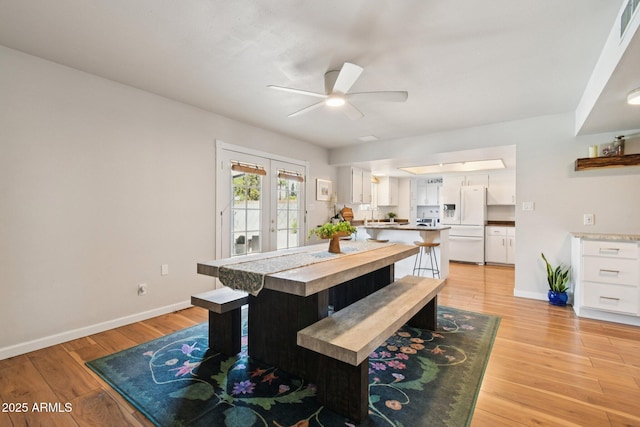 13842 N 40th Ave, Phoenix, AZ 85053 - dining space featuring a ceiling fan, light wood-type flooring, and french doors