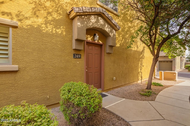 doorway to property with stucco siding