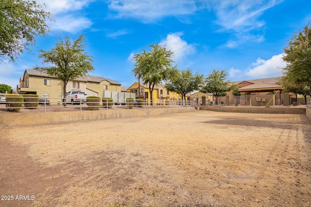 view of yard featuring a residential view and fence