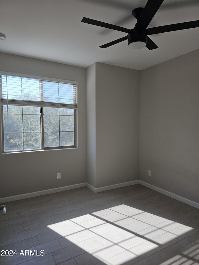 empty room featuring ceiling fan and light hardwood / wood-style flooring