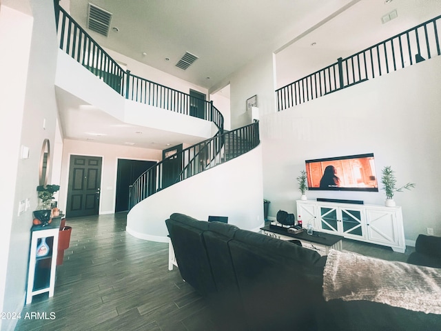 living room featuring a high ceiling