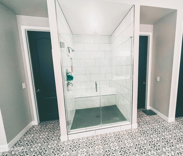 bathroom with a shower with shower door