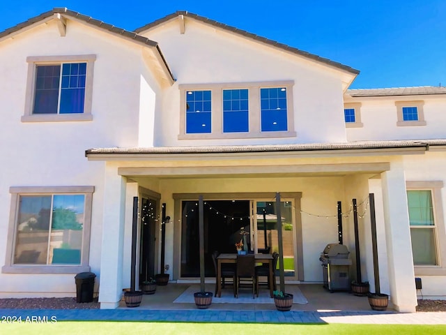 back of house featuring a patio area