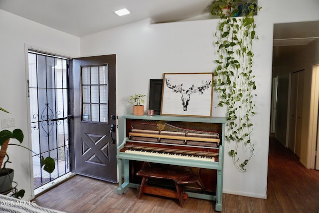 entrance foyer featuring hardwood / wood-style flooring and a healthy amount of sunlight