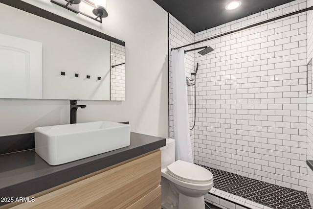 full bath featuring a shower stall, toilet, vanity, and recessed lighting