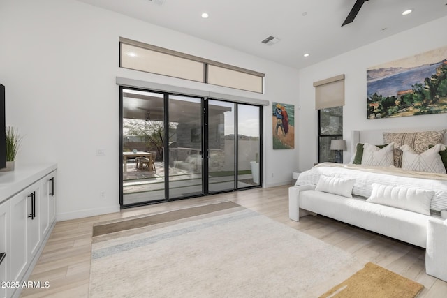 bedroom featuring access to exterior, light wood-type flooring, and ceiling fan