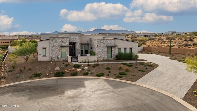 view of front of home with a mountain view