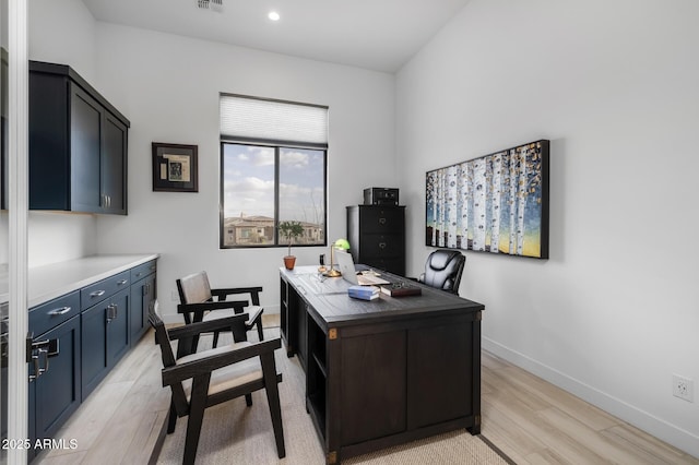 office with light hardwood / wood-style flooring