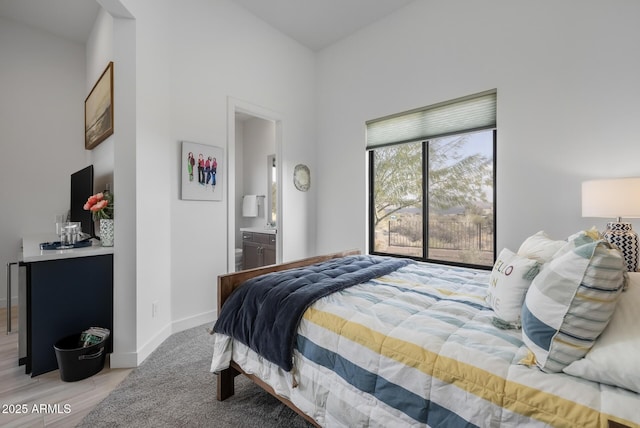 bedroom featuring ensuite bath