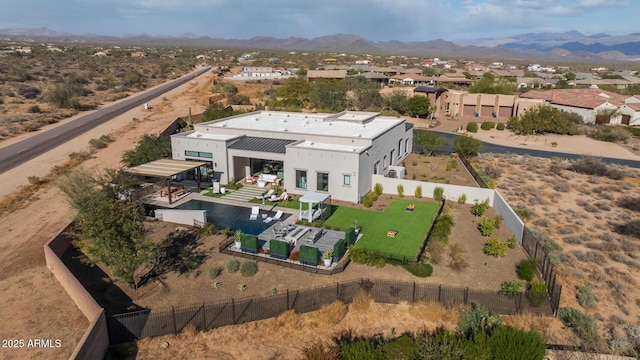 birds eye view of property featuring a mountain view