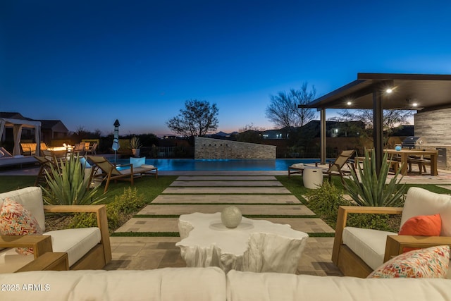 patio terrace at dusk with an outdoor living space