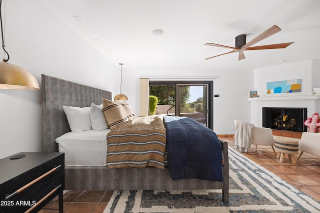 bedroom with access to exterior and ceiling fan