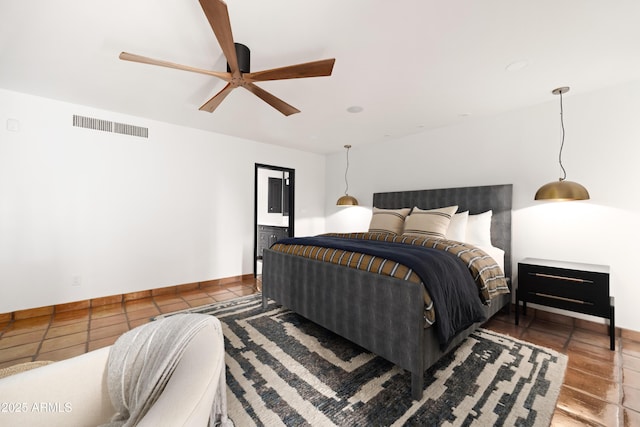 tiled bedroom with ceiling fan