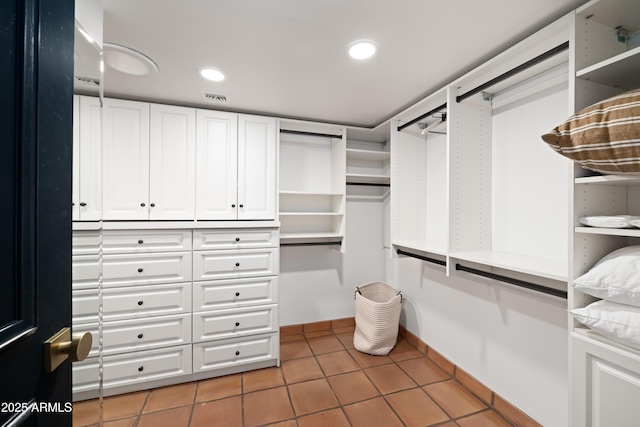 walk in closet featuring tile patterned flooring