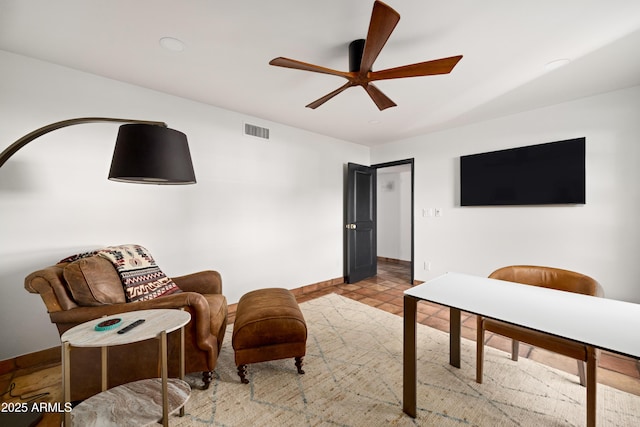 living room featuring ceiling fan