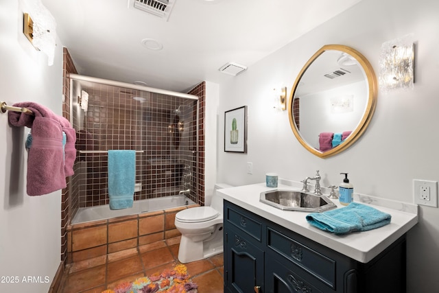 full bathroom with vanity, toilet, and shower / bath combination with glass door