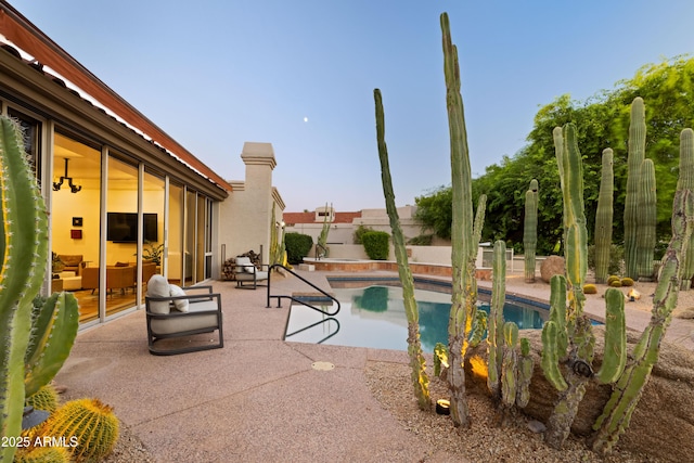 view of swimming pool with a patio