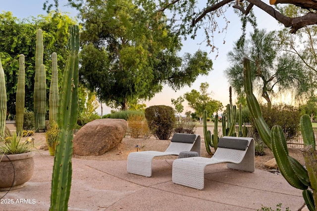 view of patio terrace at dusk