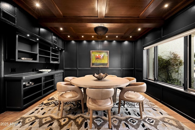 interior space with beam ceiling, coffered ceiling, and wood ceiling