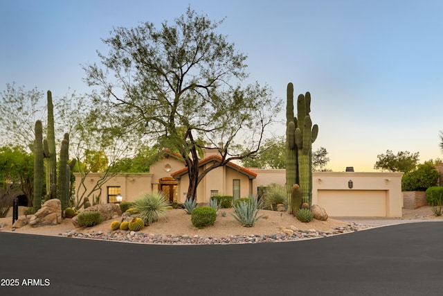 adobe home featuring a garage