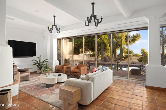 living room featuring tile patterned floors, beam ceiling, and a chandelier