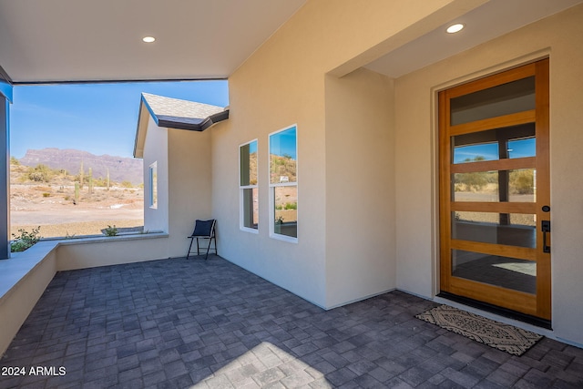 3877 S Veronica Ln, Gold Canyon, AZ 85118 - entrance to property with stucco siding, a mountain view, and a patio area