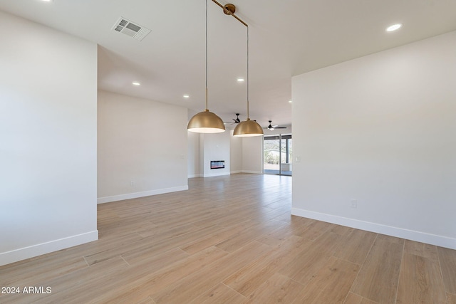 3877 S Veronica Ln, Gold Canyon, AZ 85118 - unfurnished living room with baseboards, light wood finished floors, a ceiling fan, and recessed lighting