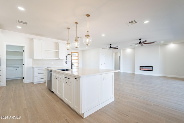 3877 S Veronica Ln, Gold Canyon, AZ 85118 - kitchen with a sink, open shelves, dishwasher, light countertops, and a ceiling fan