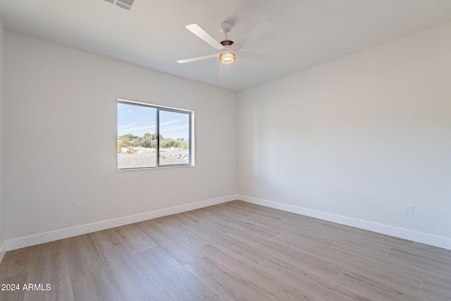 3877 S Veronica Ln, Gold Canyon, AZ 85118 - spare room featuring light wood finished floors, baseboards, and ceiling fan