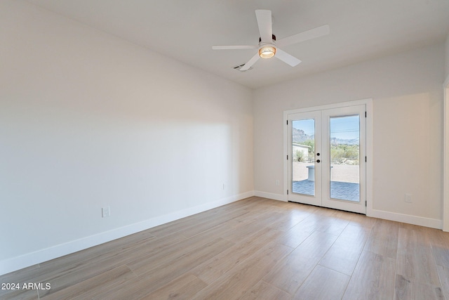 3877 S Veronica Ln, Gold Canyon, AZ 85118 - spare room featuring french doors, light wood-type flooring, baseboards, and ceiling fan