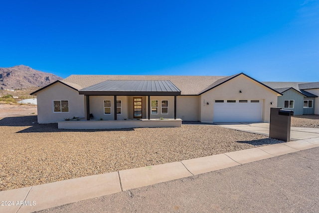 3877 S Veronica Ln, Gold Canyon, AZ 85118 - ranch-style house featuring covered porch, a garage, concrete driveway, a mountain view, and stucco siding