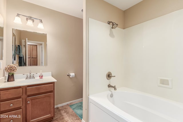 bathroom featuring shower / tub combination, vanity, and tile patterned floors